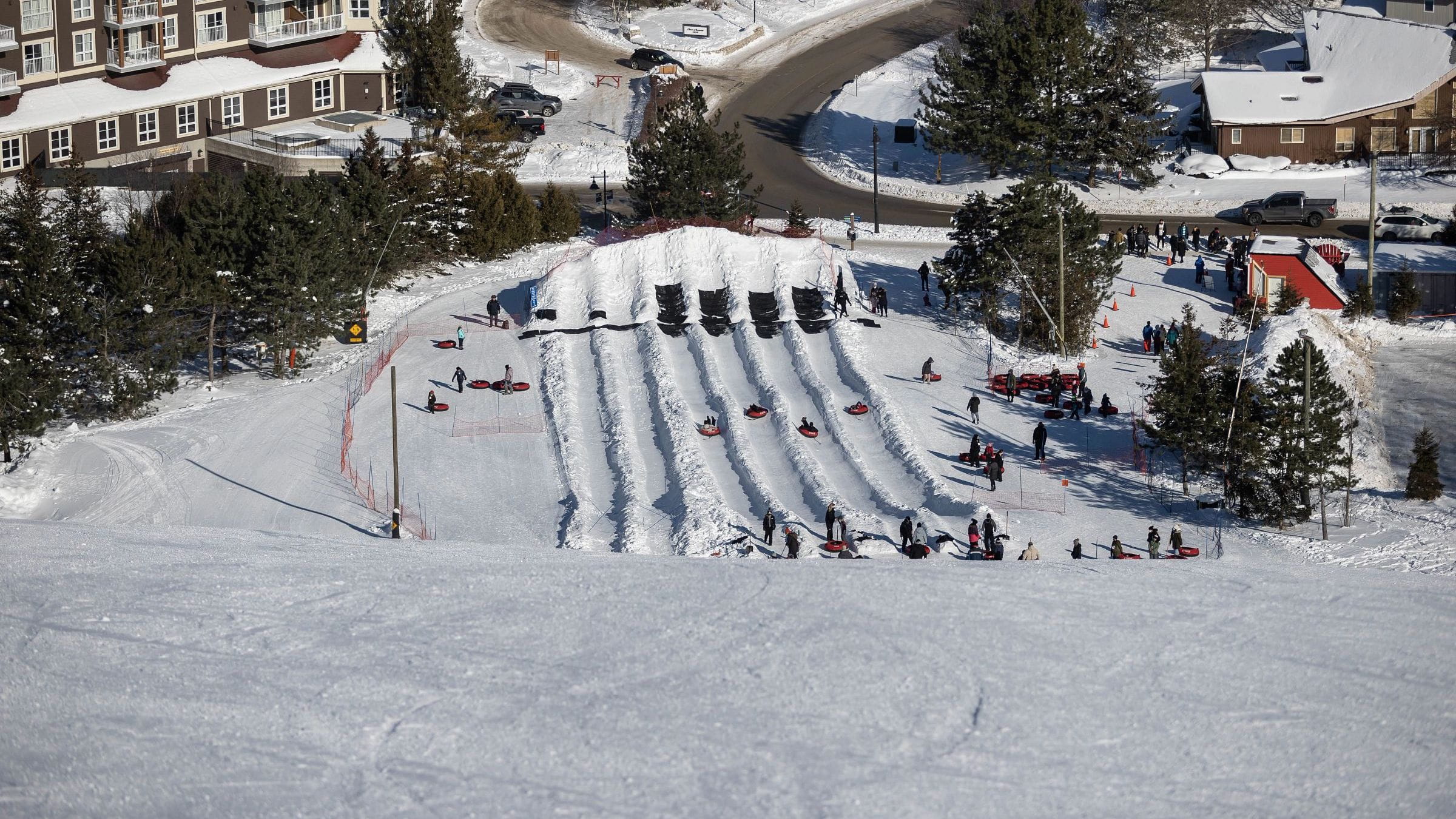 Birdseye view of Hike N Tube tracks with people snow tubing at Blue Mountain Resort