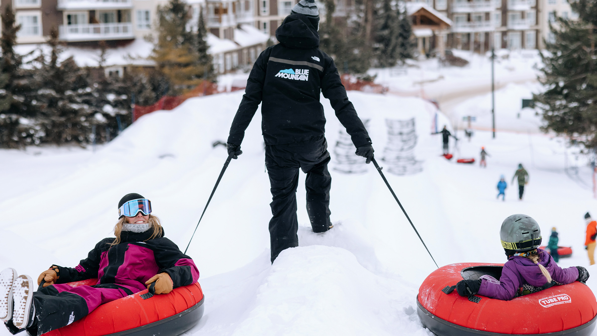 Two people in Blue Mountain Tubes to go tubing