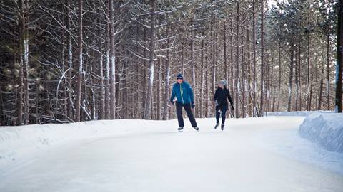 Two people skating on the Woodview Mountaintop Skating Trail at Blue Mountain