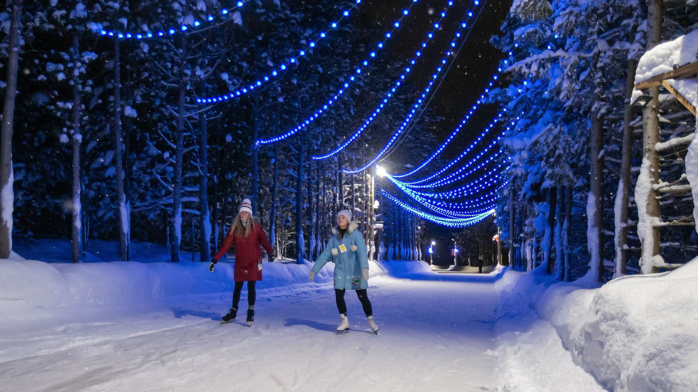 Two people skating at night on Woodview Mountaintop Skating at Blue Mountain