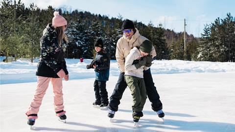 Family skating on Woodview Mountaintop Skating at Blue Mountain