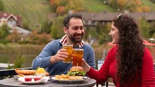 Couple eating on the patio at Blue Mountain Resort