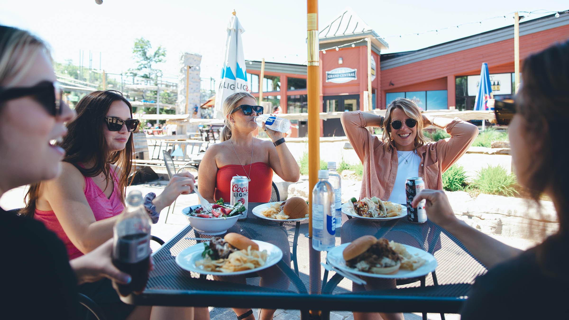 Group of friends enjoying lunch on a patio at Blue Mountain