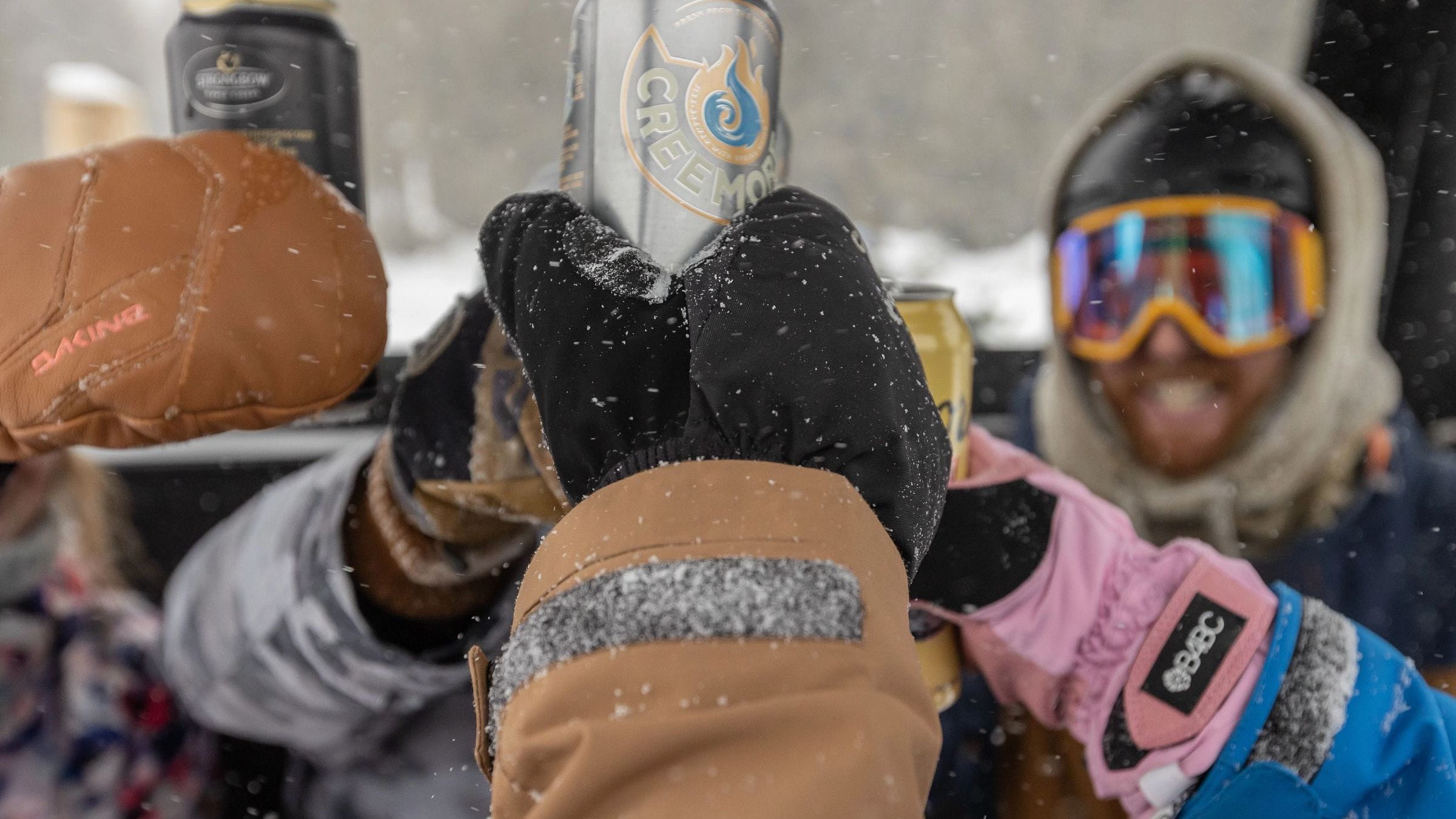 Friends cheering at the top of Blue Mountain at Off Piste