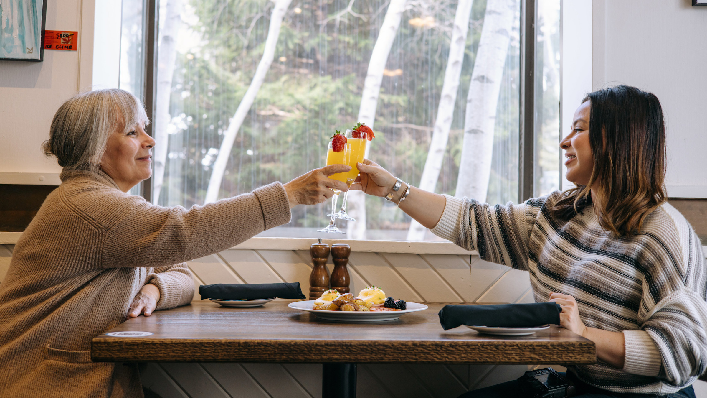 Mother and daughter enjoying a brunch and mimosa at the Pottery for Mothers Day