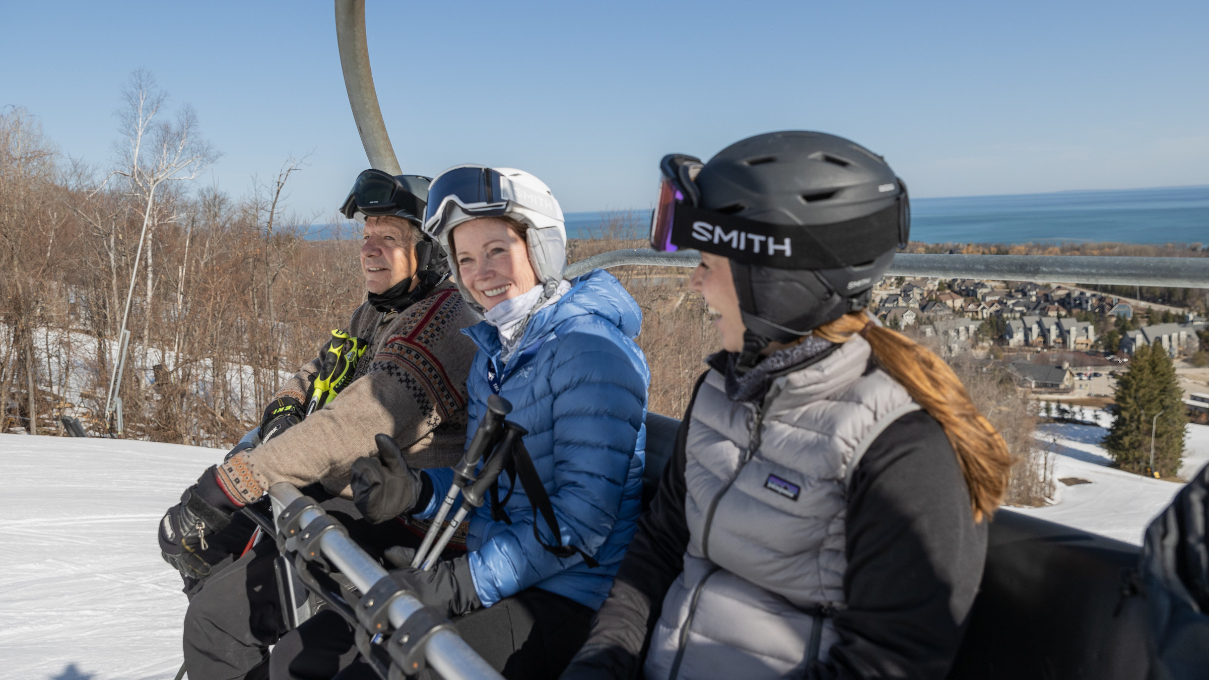 Skiers and snowboarders on lift at Blue Mountain in Spring