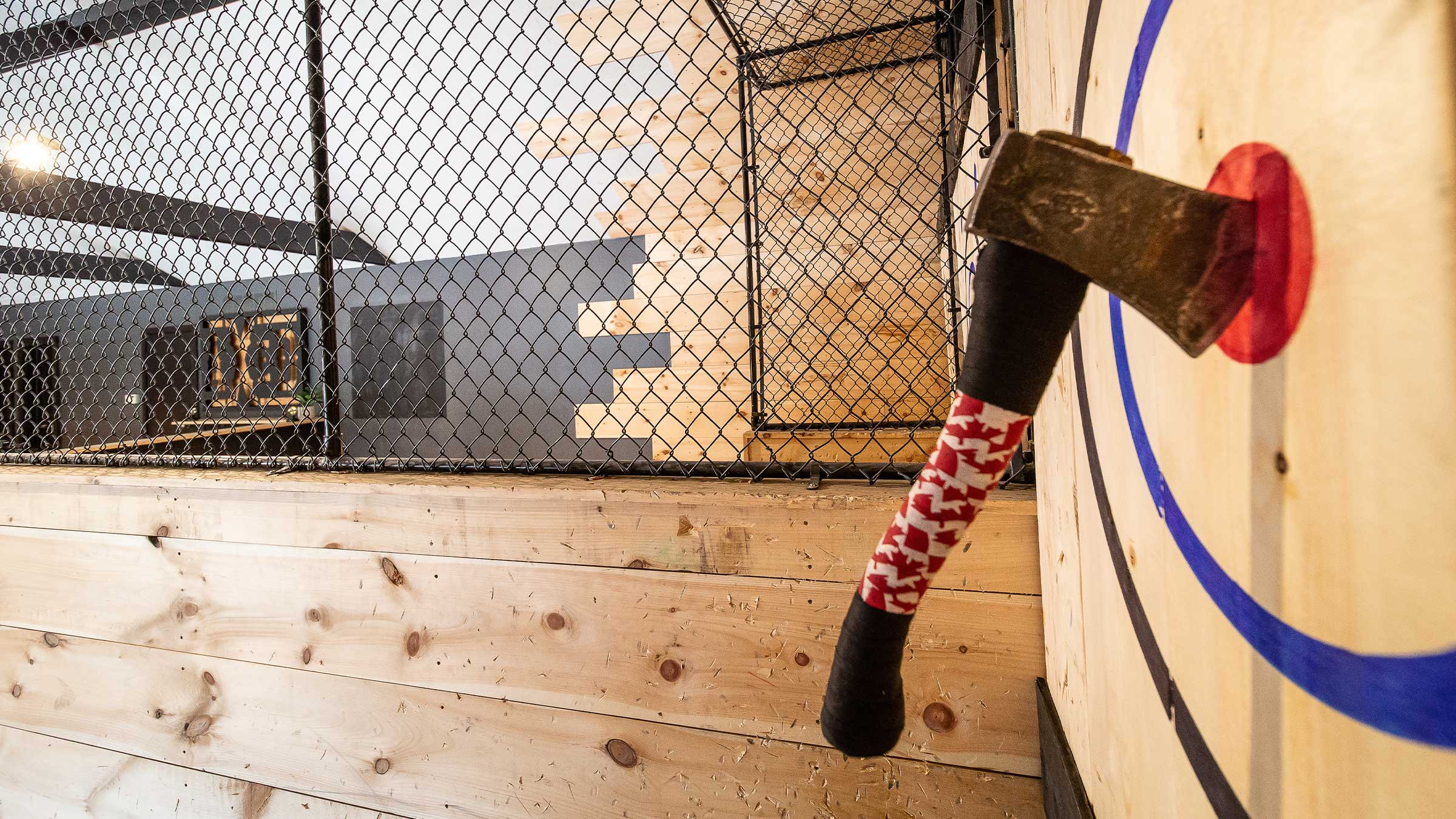 Axe stuck in bullseye on target