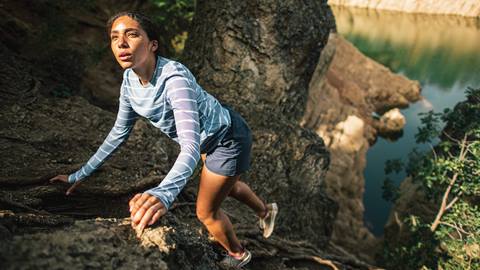 Woman Climbing Rocks