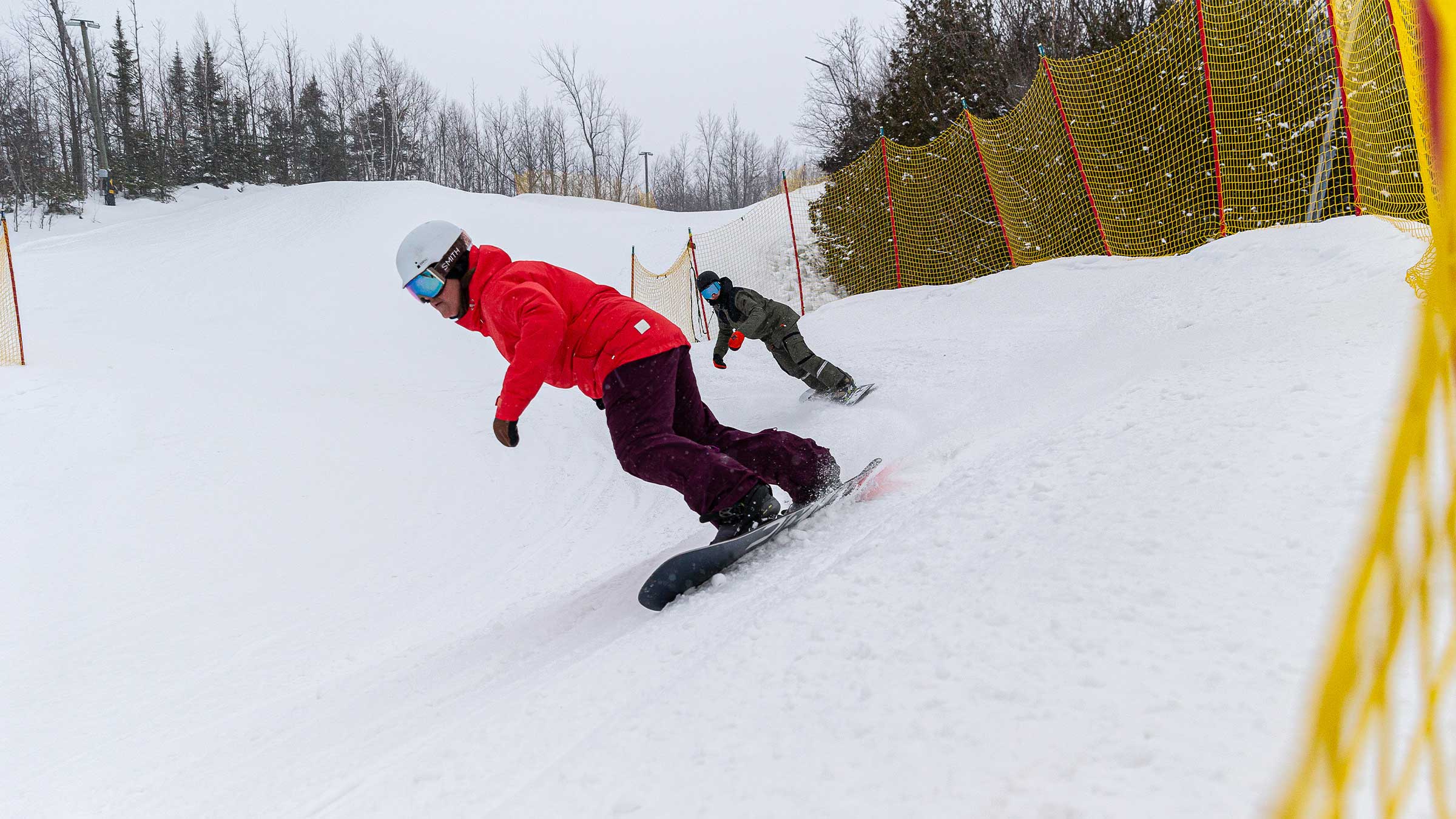 People racing on snow cross track