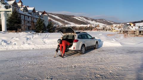 a skier getting ready for skiing in their car
