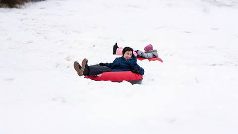 a person sitting on the snow