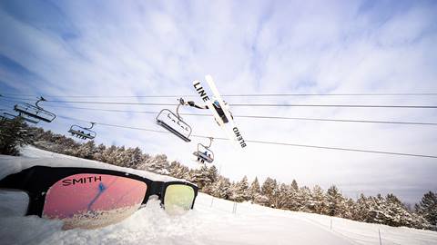 A skier jumping over the SMITH sunglasses