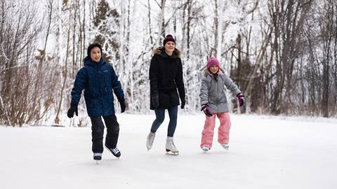 a group of people standing on top of a snow covered slope