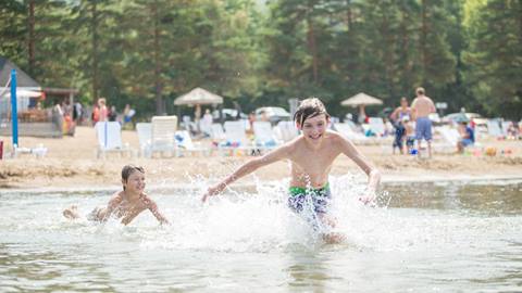 Boys playing in sand at beach