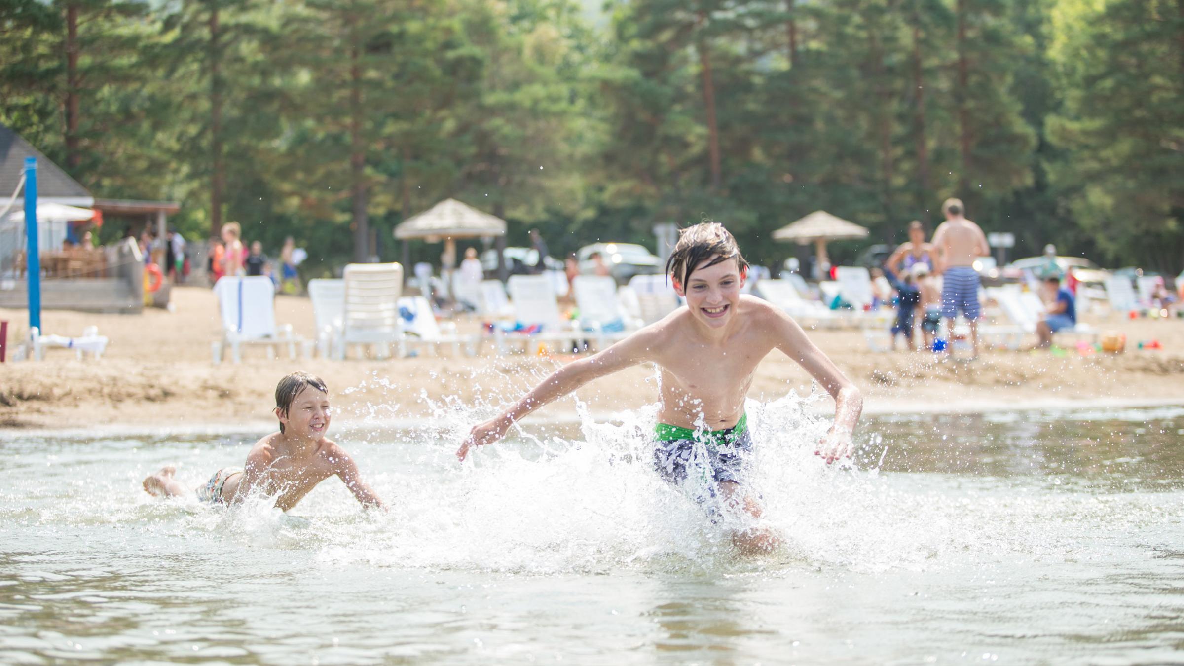 Boys playing in sand at beach