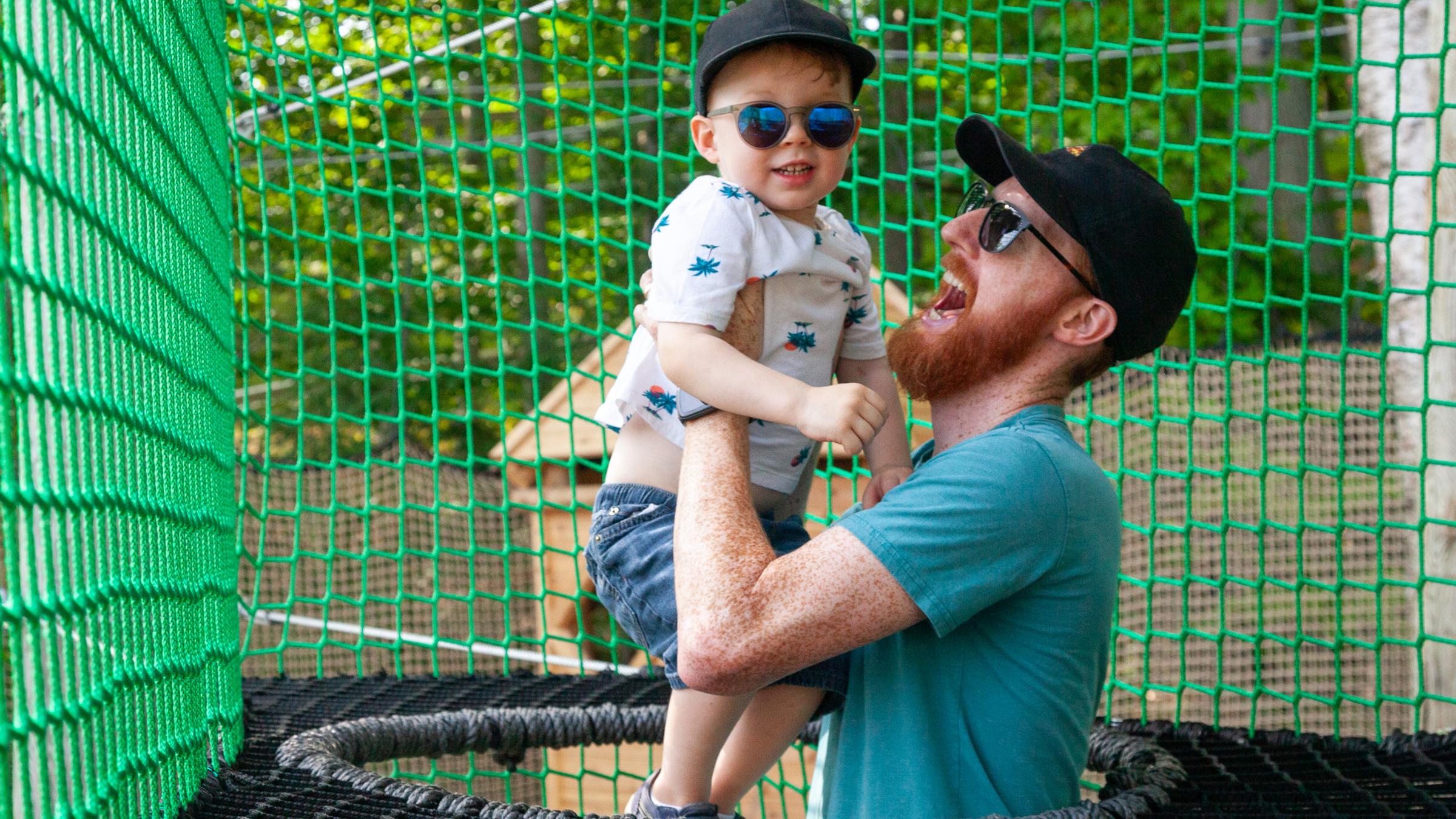 Kids and adults playing on Canopy Climb Net Adventure