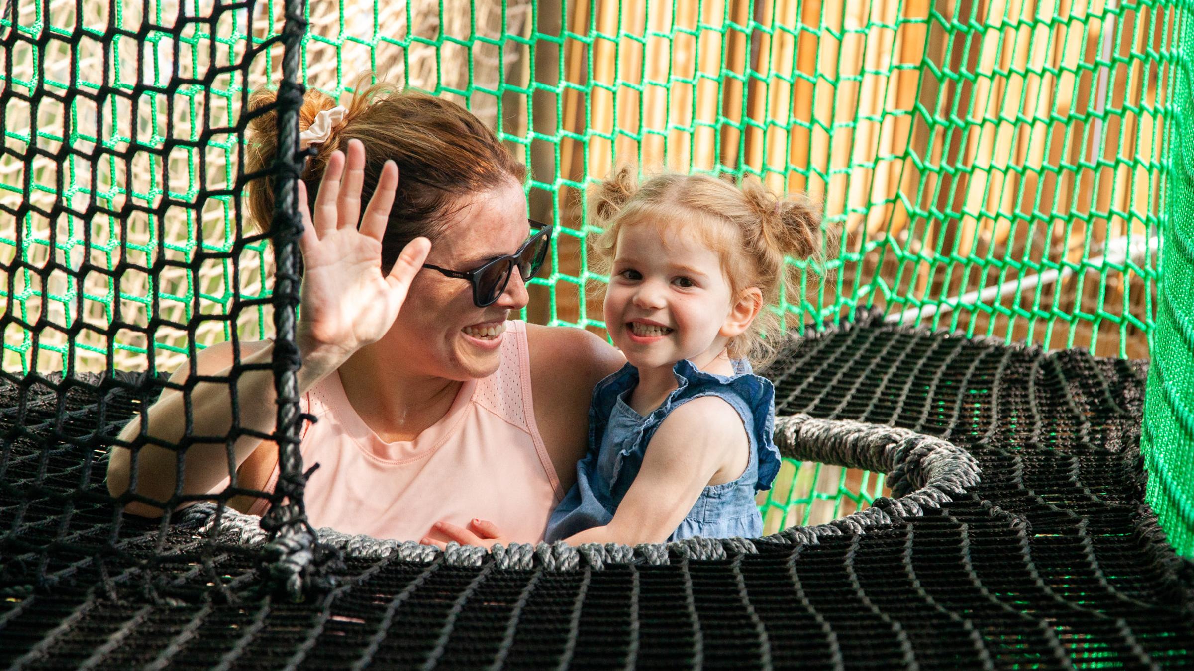 Kids and adults playing on Canopy Climb Net Adventure