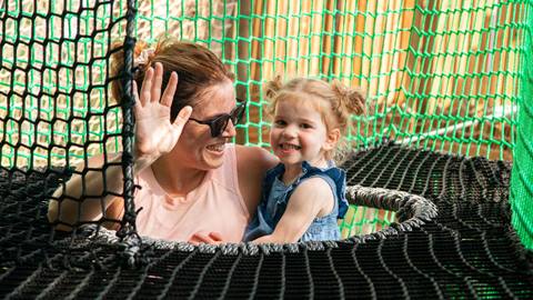 Kids and adults playing on Canopy Climb Net Adventure