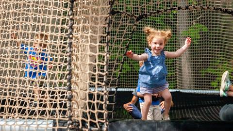 Kids and adults playing on Canopy Climb Net Adventure