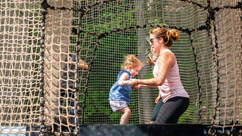 Kids and adults playing on Canopy Climb Net Adventure
