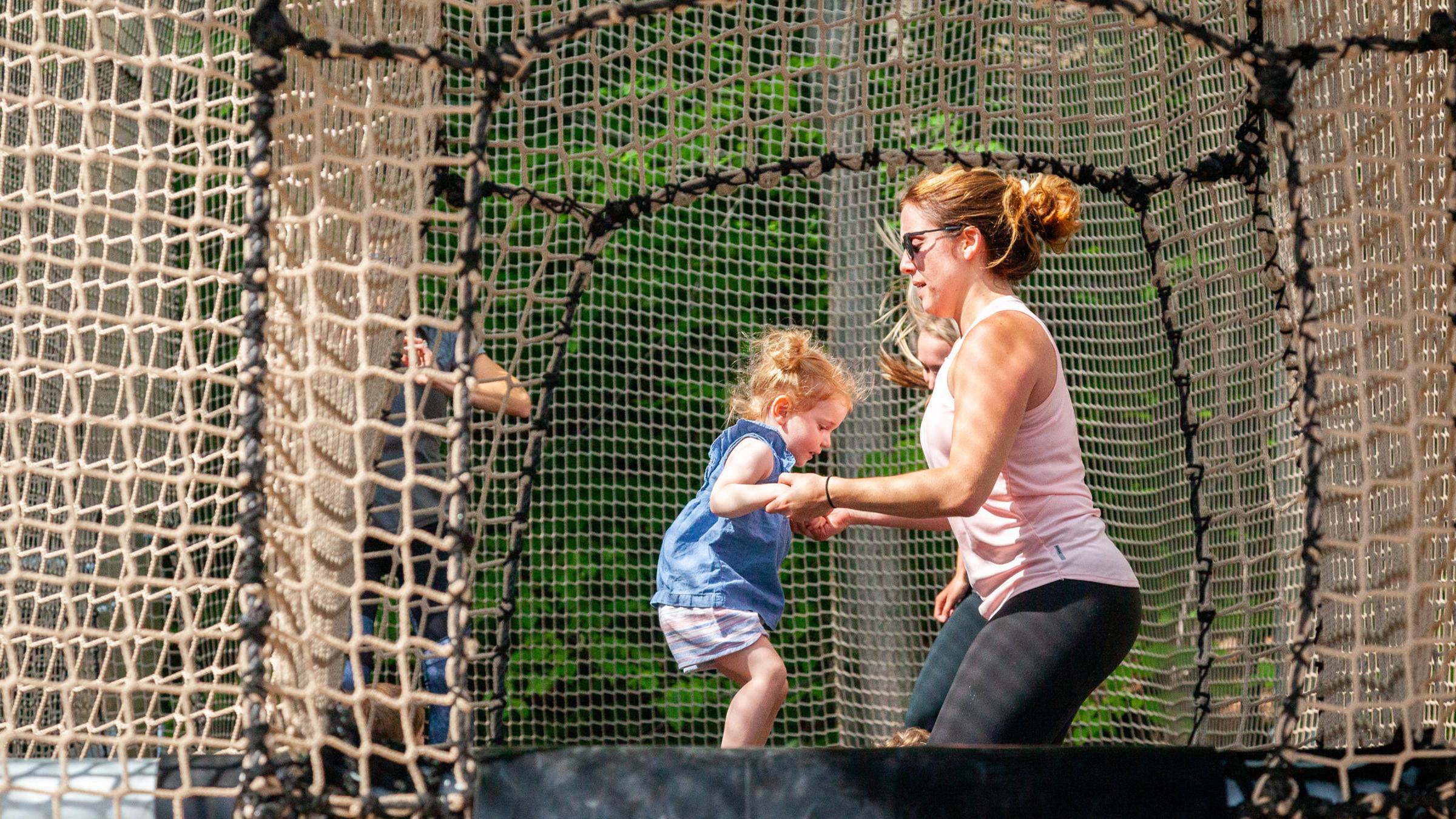 Kids and adults playing on Canopy Climb Net Adventure
