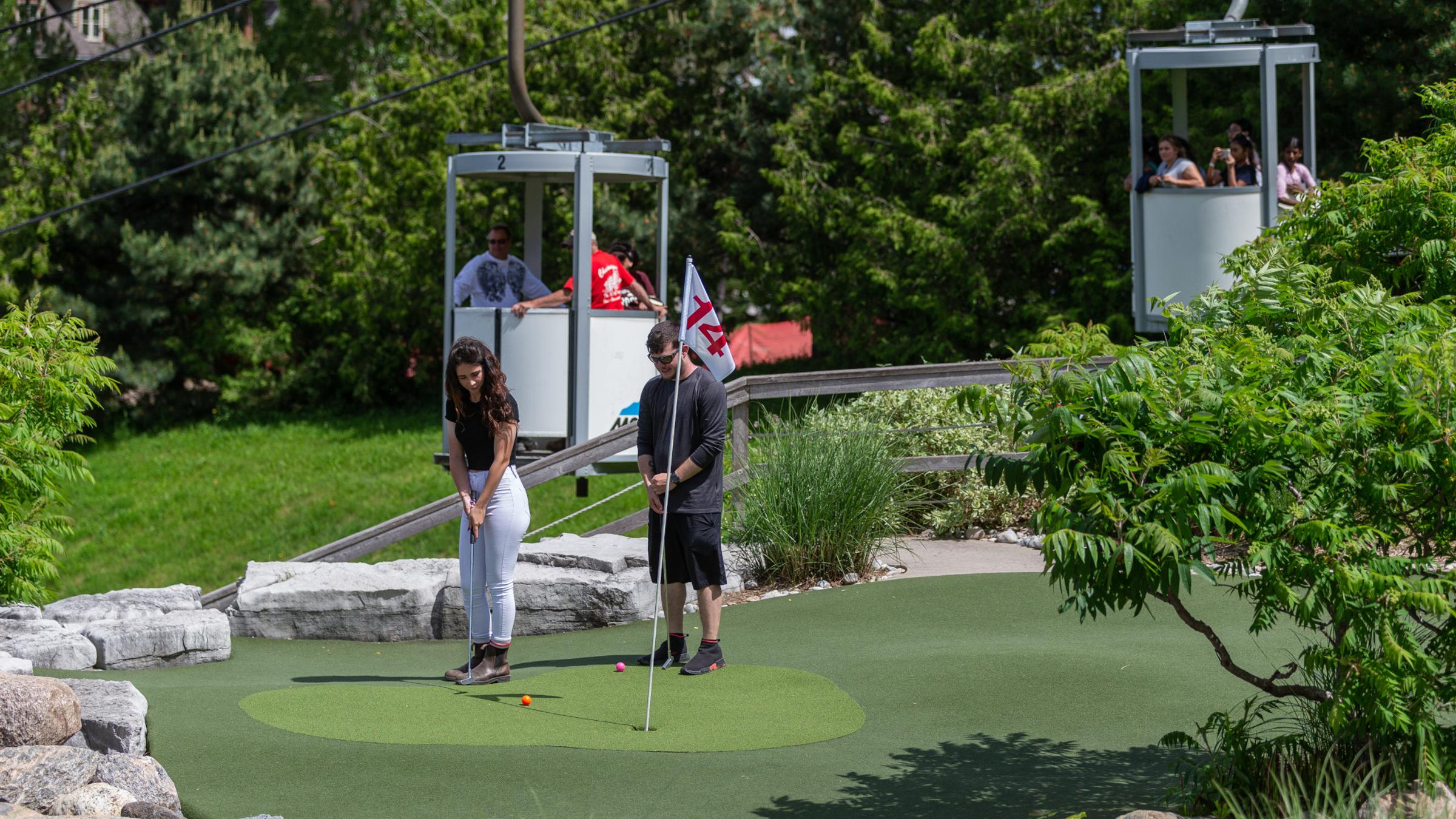 People playing on Cascade Putting Course