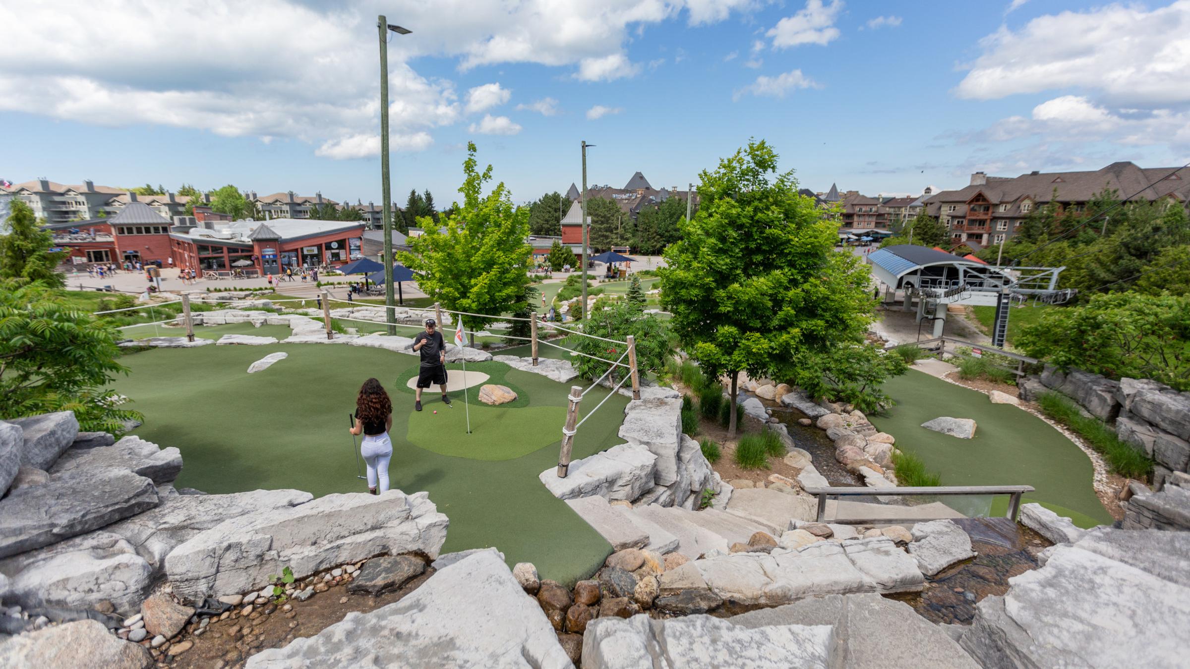 People playing on Cascade Putting Course