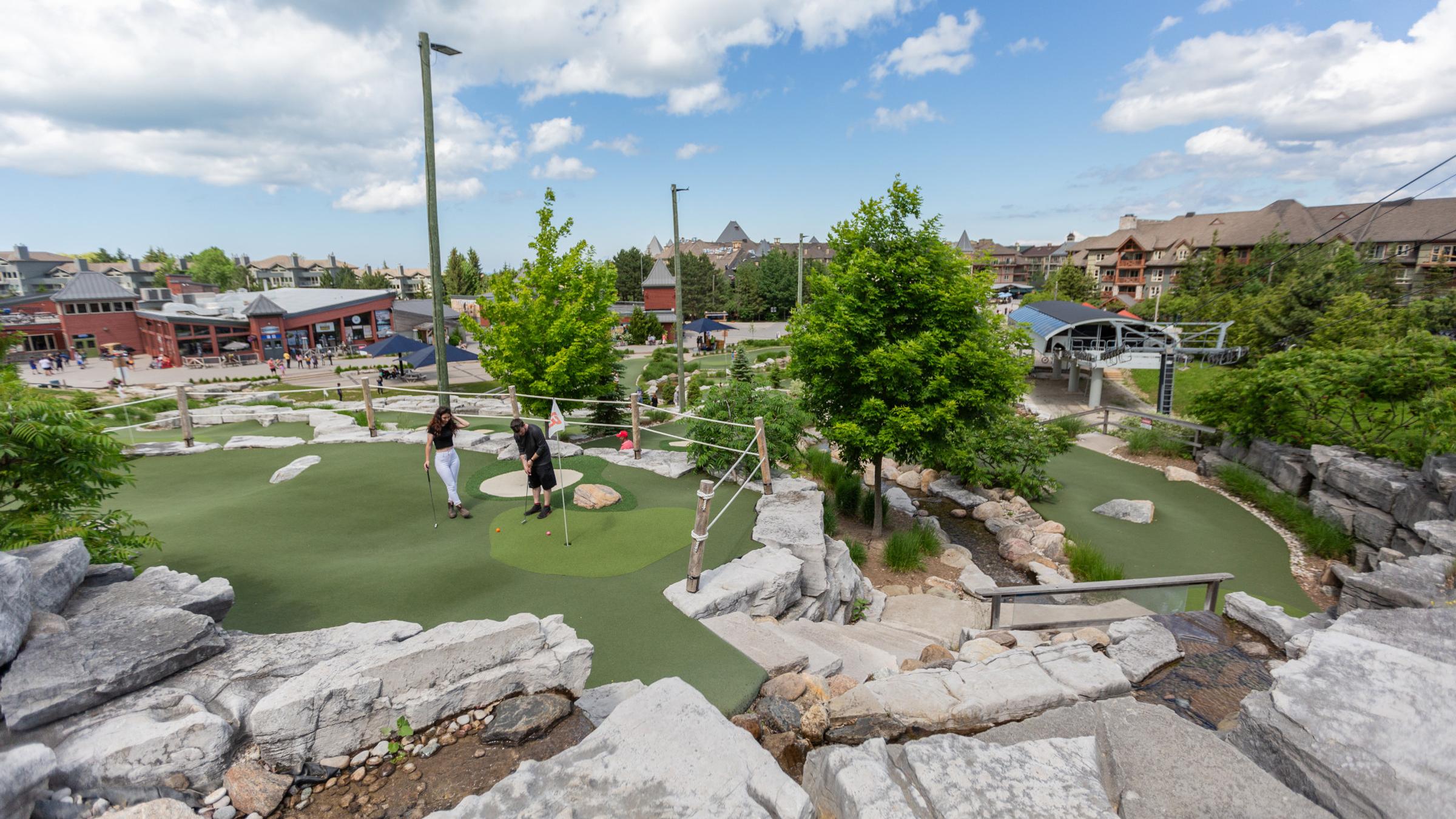 People playing on Cascade Putting Course