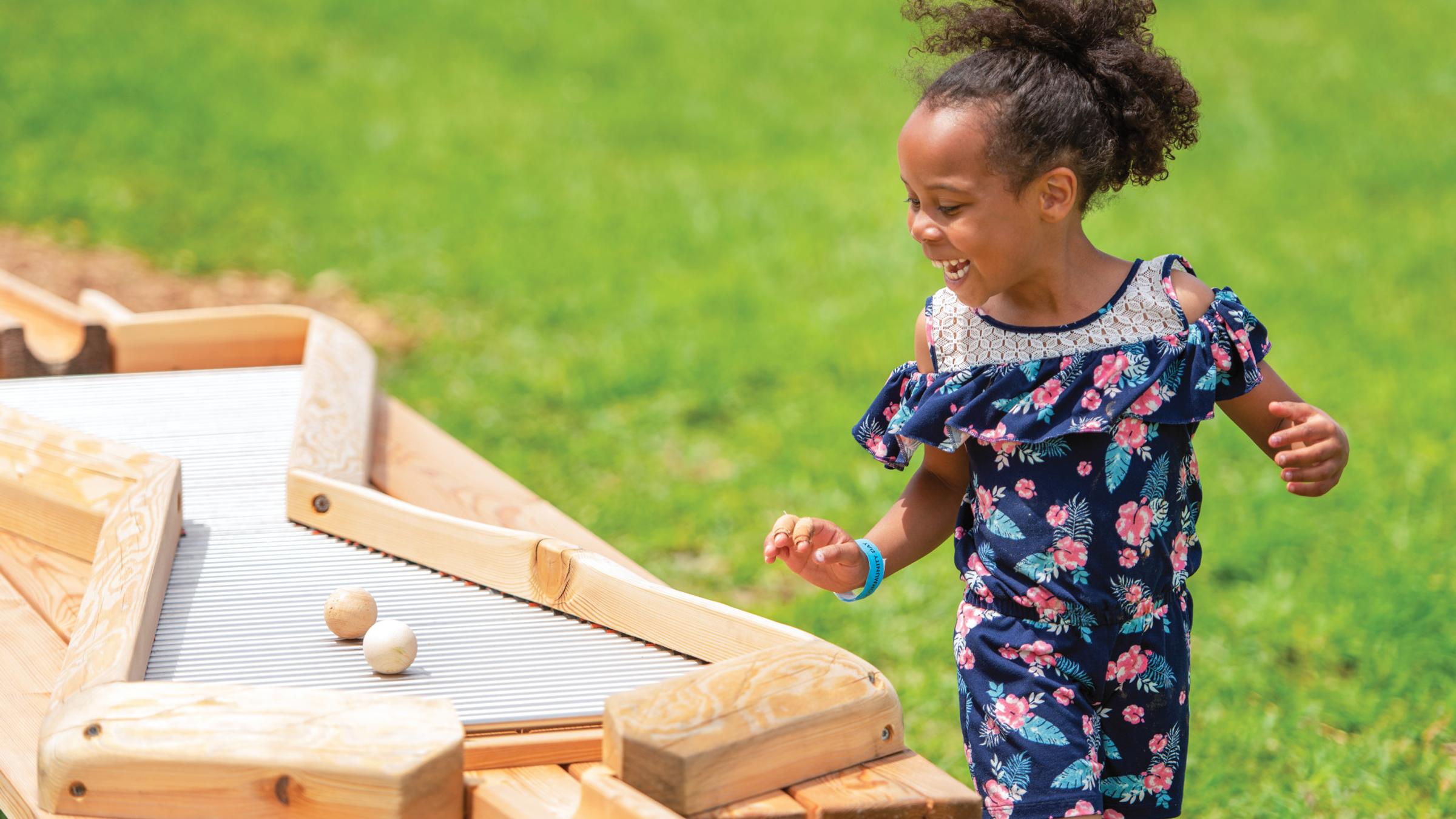 Girl playing on Ball Run