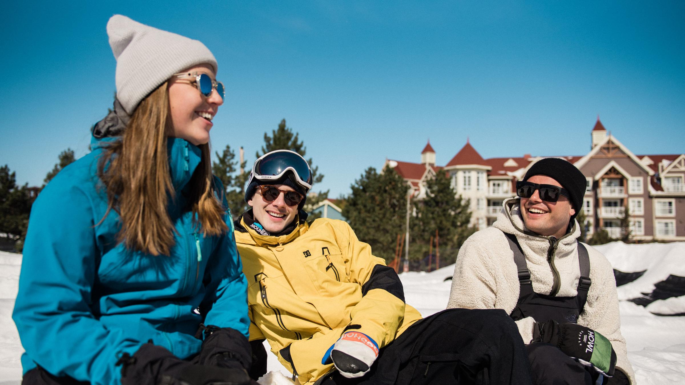 Group of young adults snow tubing