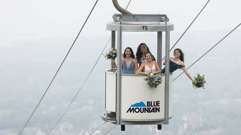 Bride and bridesmaids riding the gondola at Blue Mountain Resort