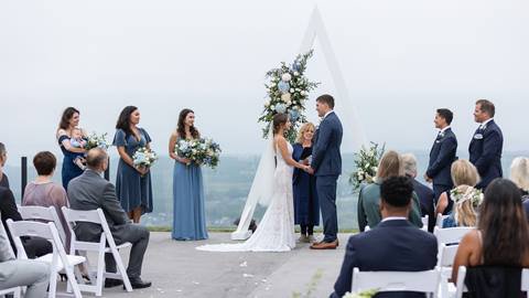 Bride and Groom standing at the top of Blue Mountain Resort
