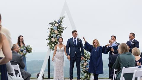 Bride and groom walking down aisle at Blue Mountain Resort