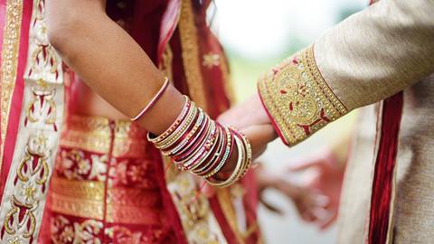 Two people holding hands 