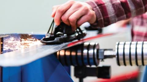 Winter Repair Shop staff working on skis and snowboards