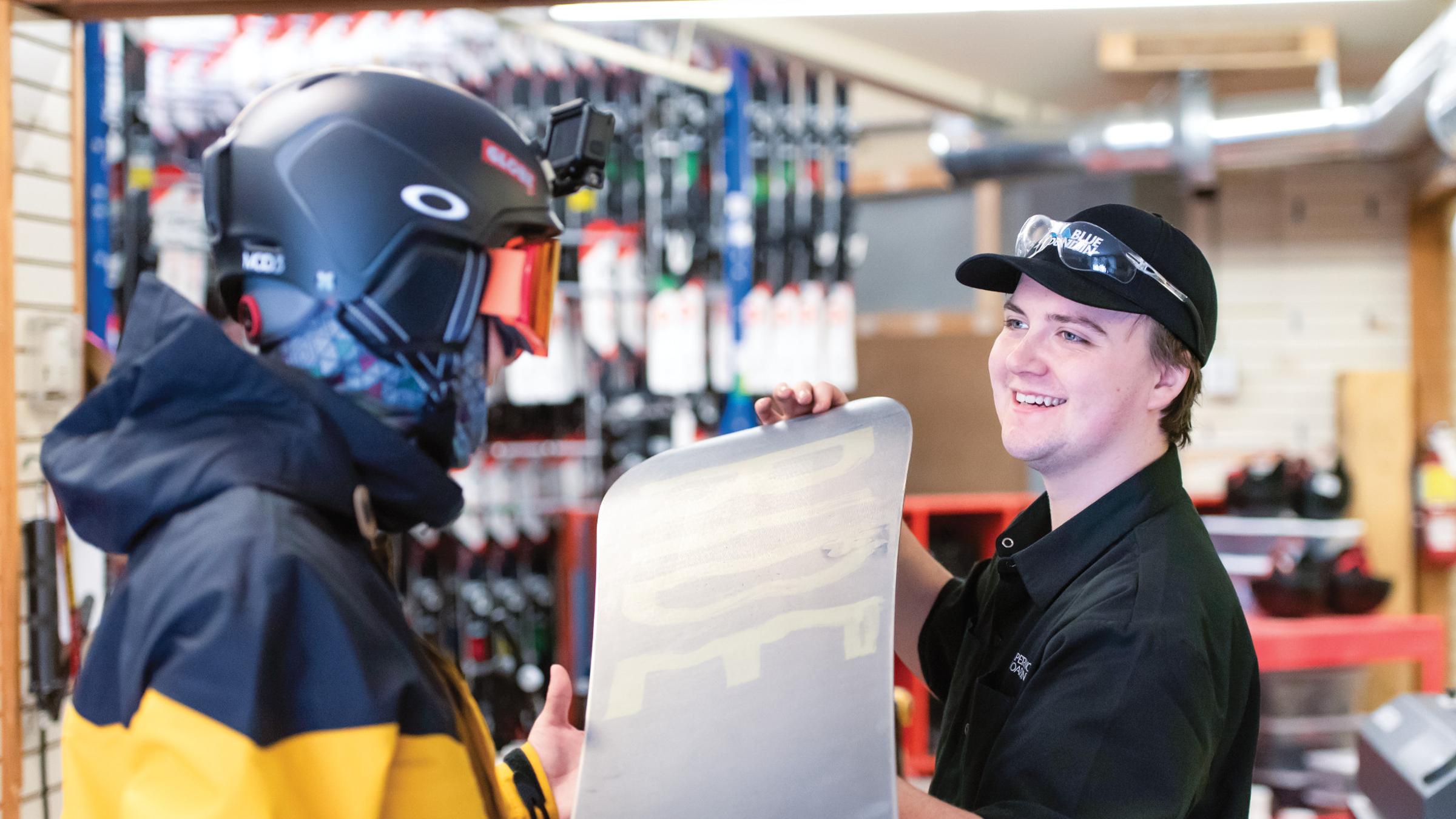 Winter Rentals staff interacting with gear and guests