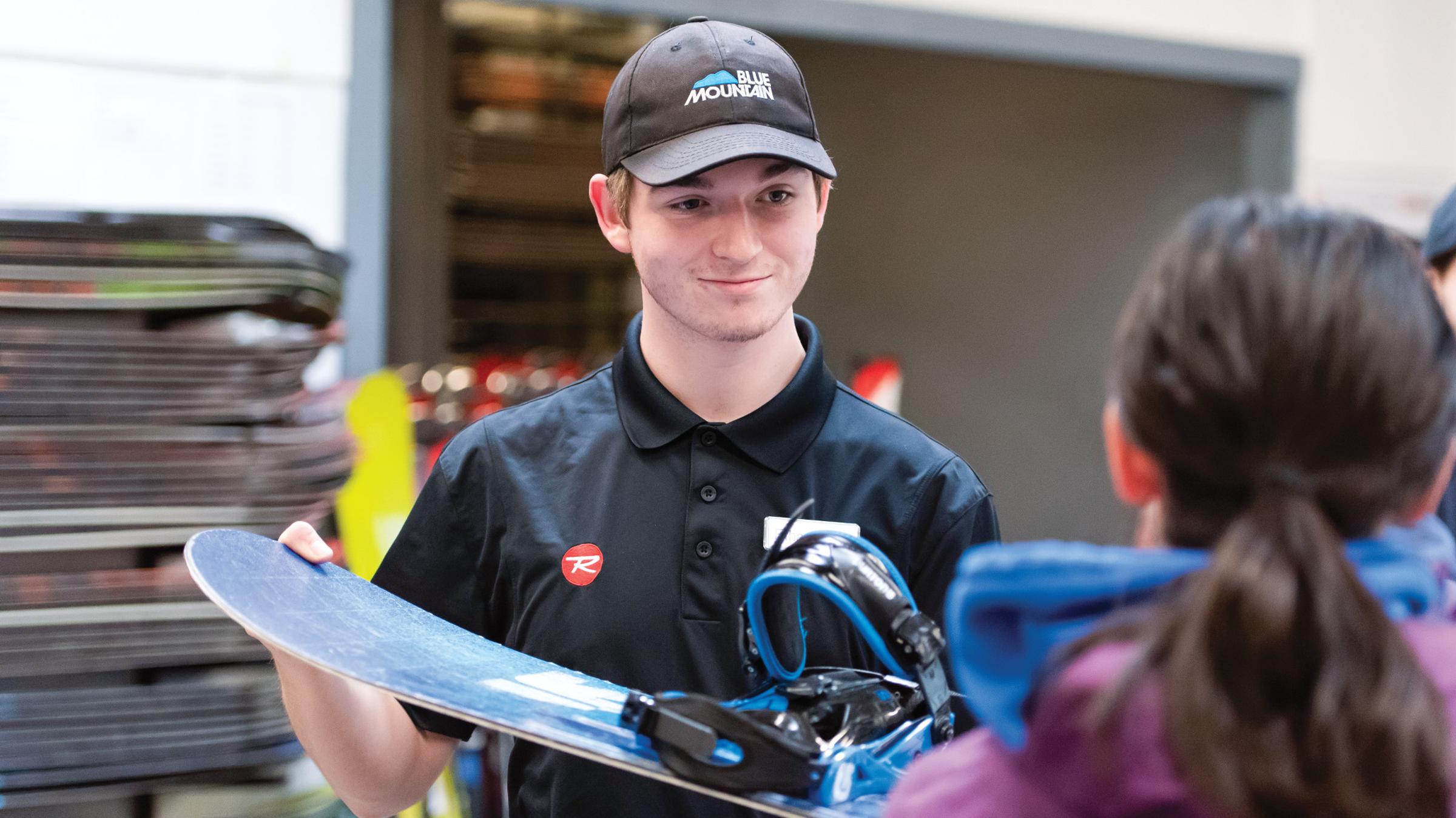 Winter Rentals staff interacting with gear and guests