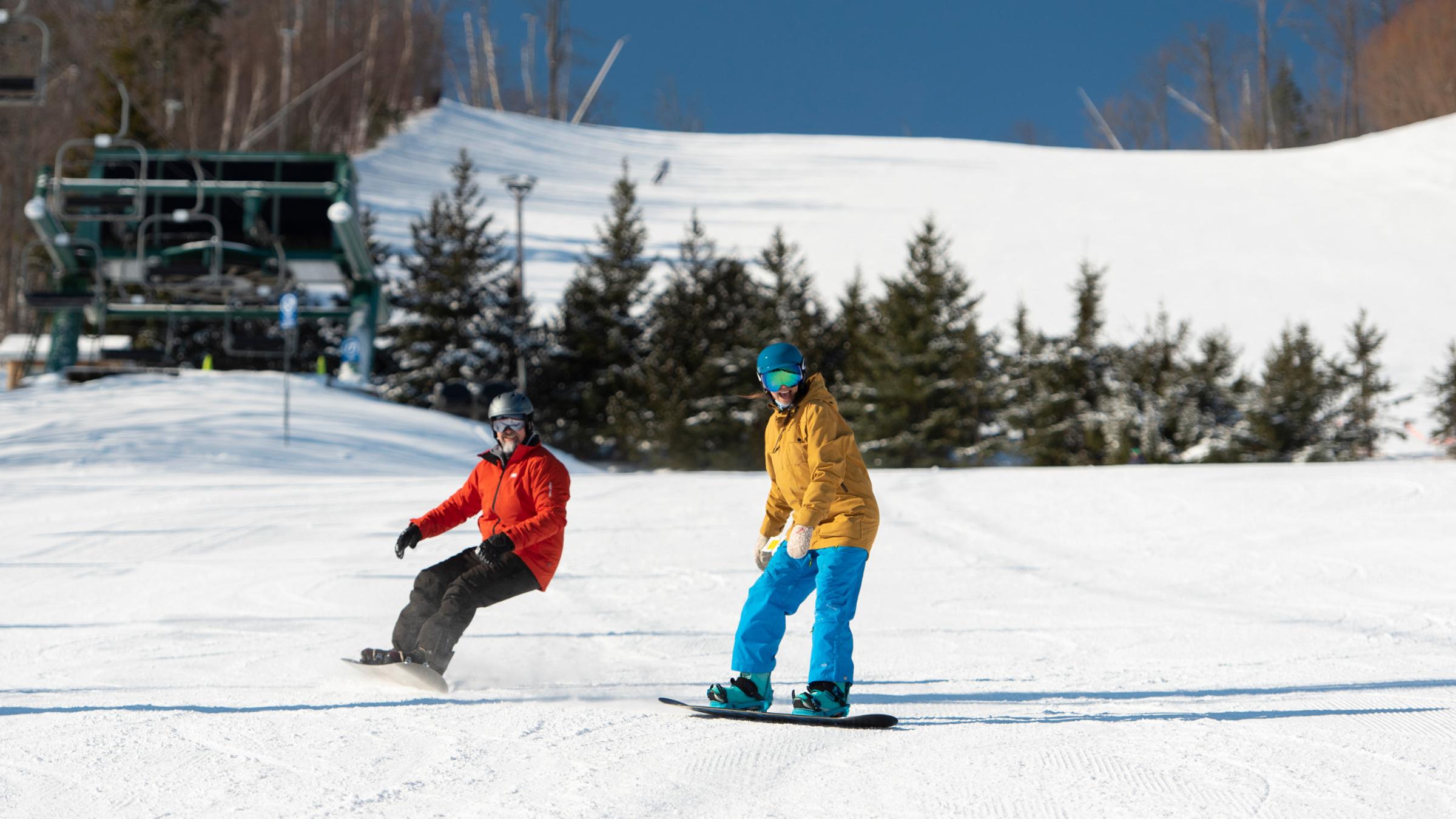snowboarders on hill