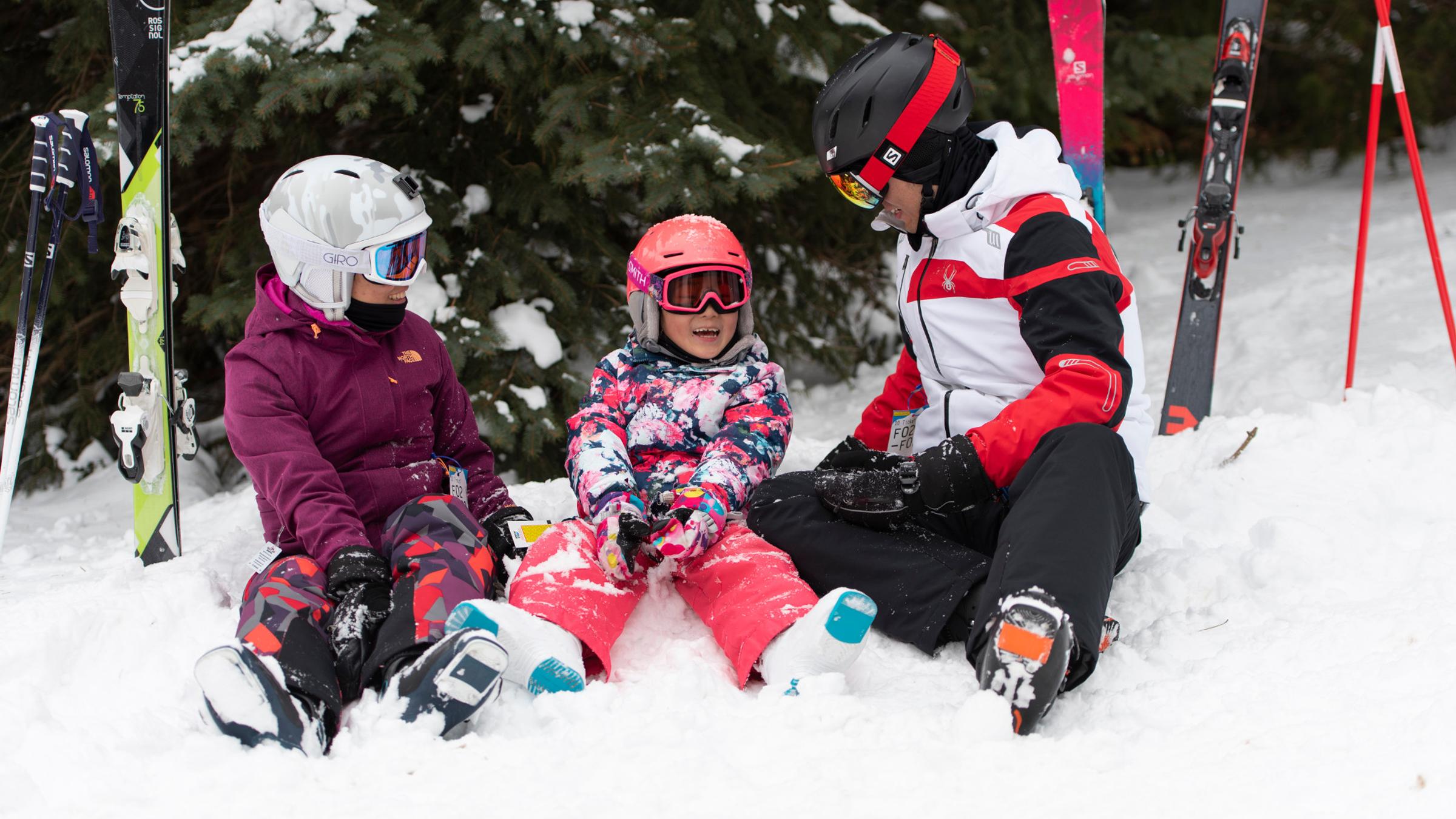 Winter lifestyle - individuals, couples and families interacting in ski and snowboard gear