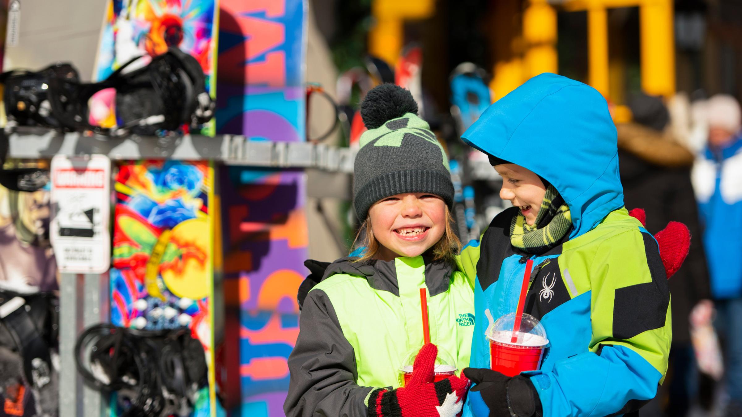 Winter lifestyle - individuals, couples and families interacting in ski and snowboard gear