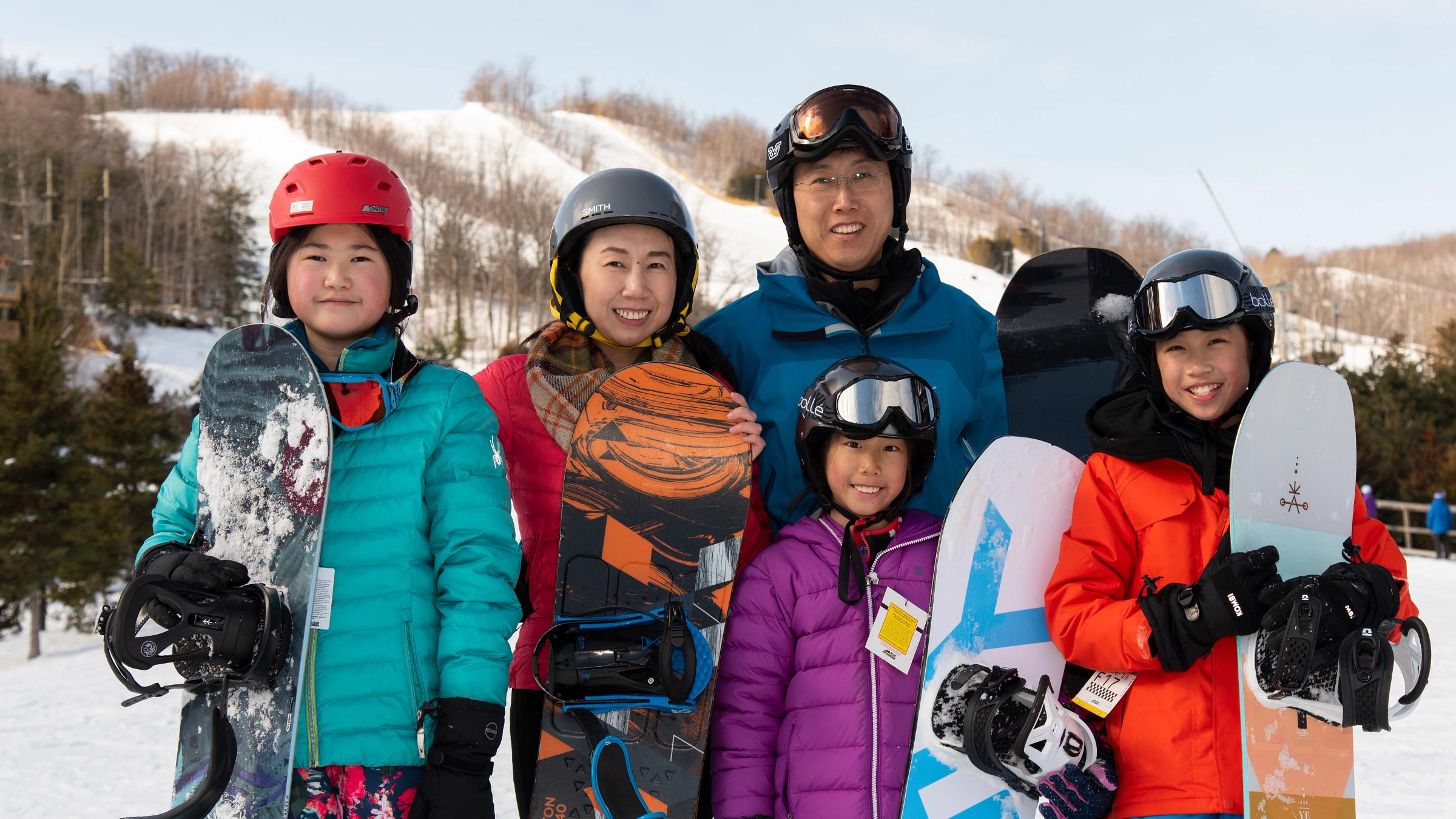 People on Hill in Winter