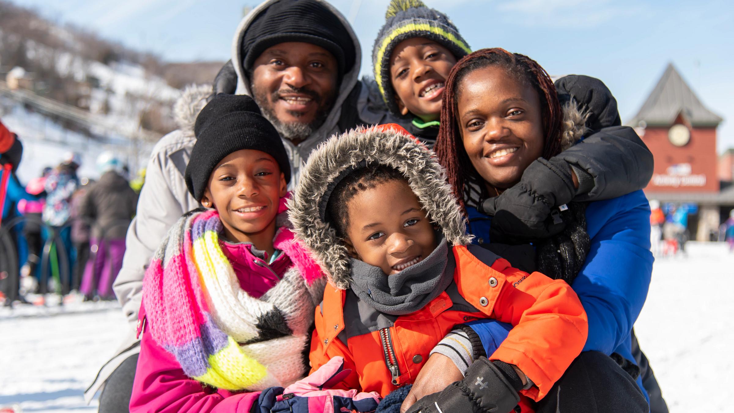 People on Hill in Winter